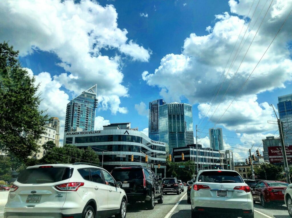 Clouds over the Atlanta skyline seen from a busy road