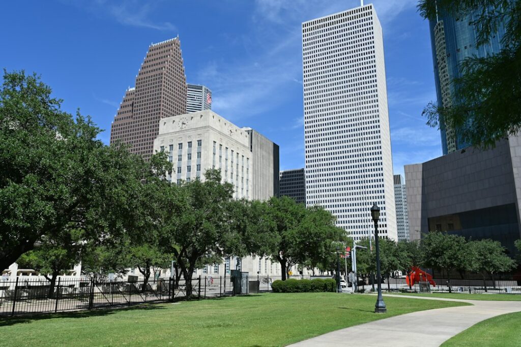 A Houston park with the city skyline behind it